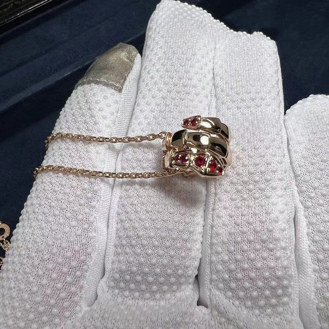 custom bulgari serpenti viper pendant necklace in 18 kt rose gold set with pave ruby on the head and tail