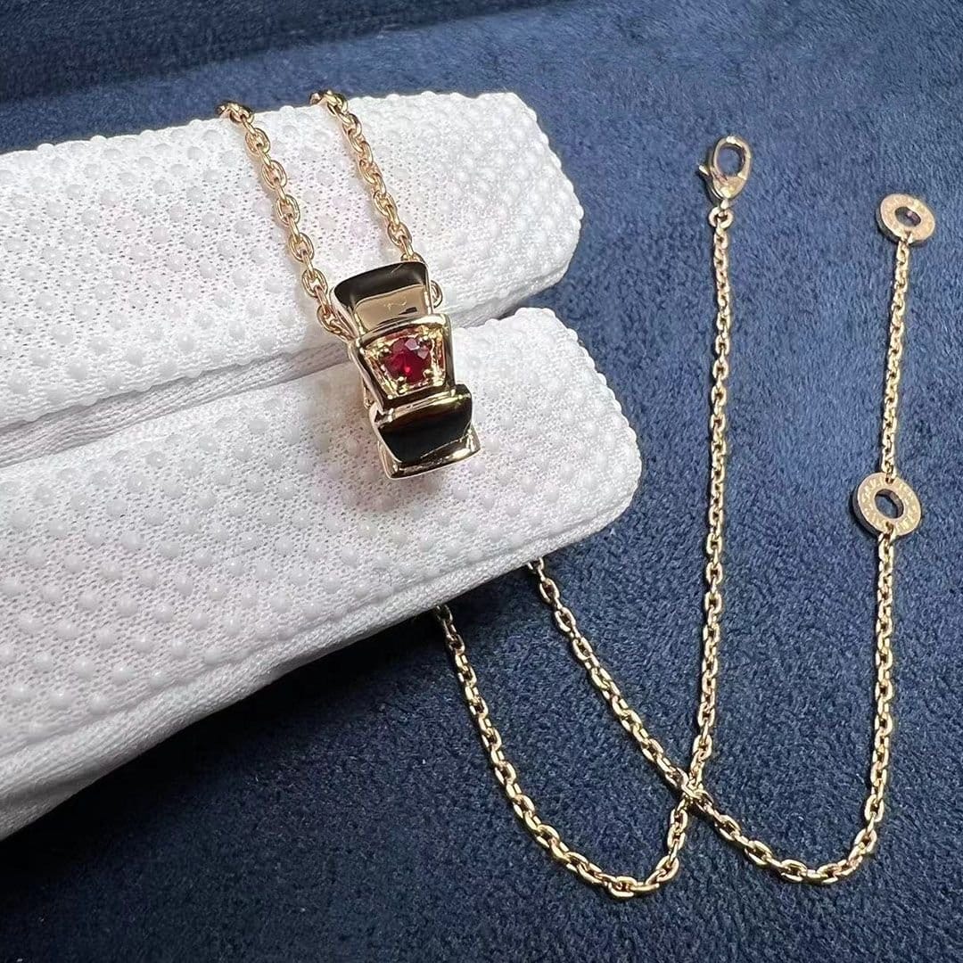 custom made bvlgari serpenti necklace set with carnelian elements and demi pave ruby