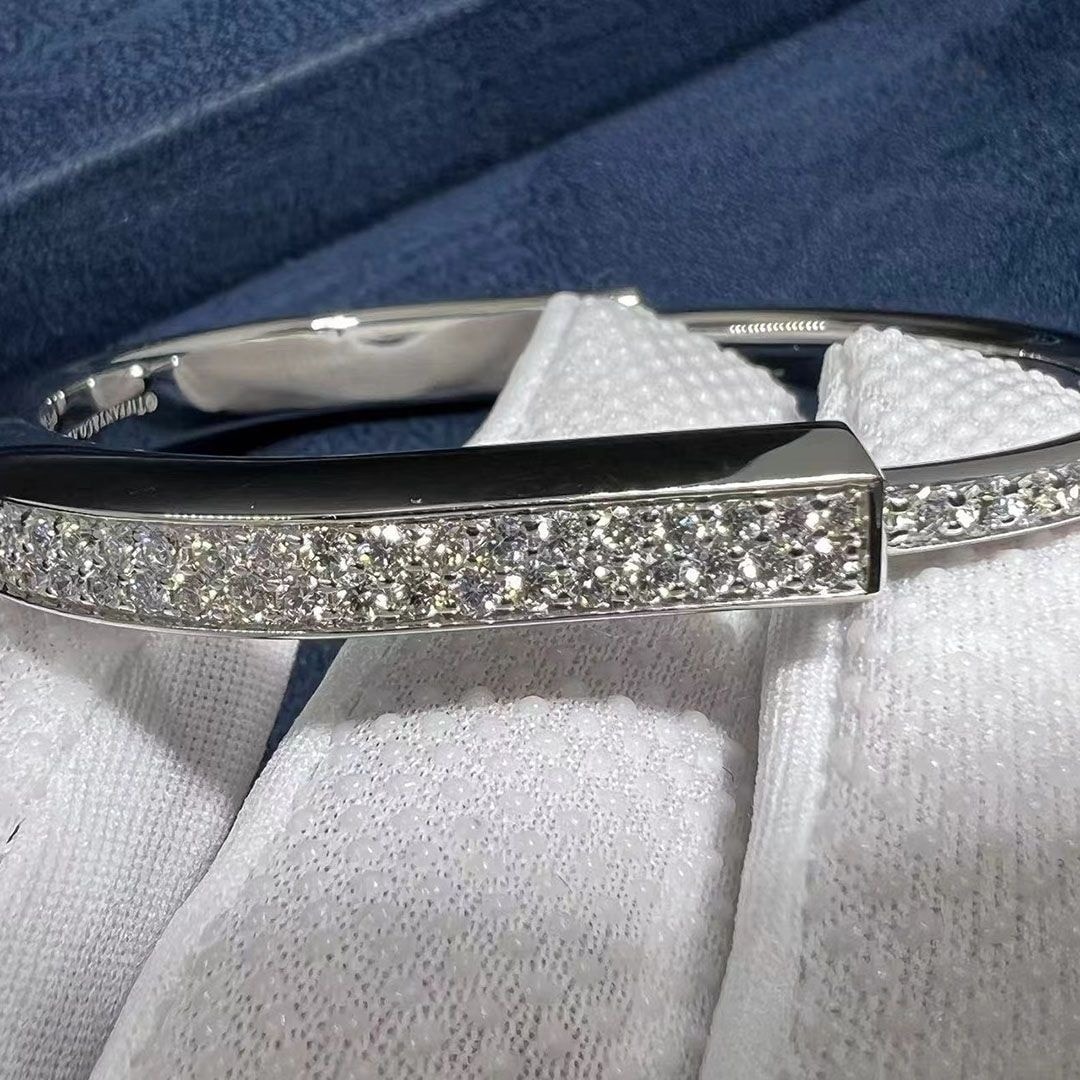 tiffany lock bangle bracelet in 18k white gold with full pave diamonds