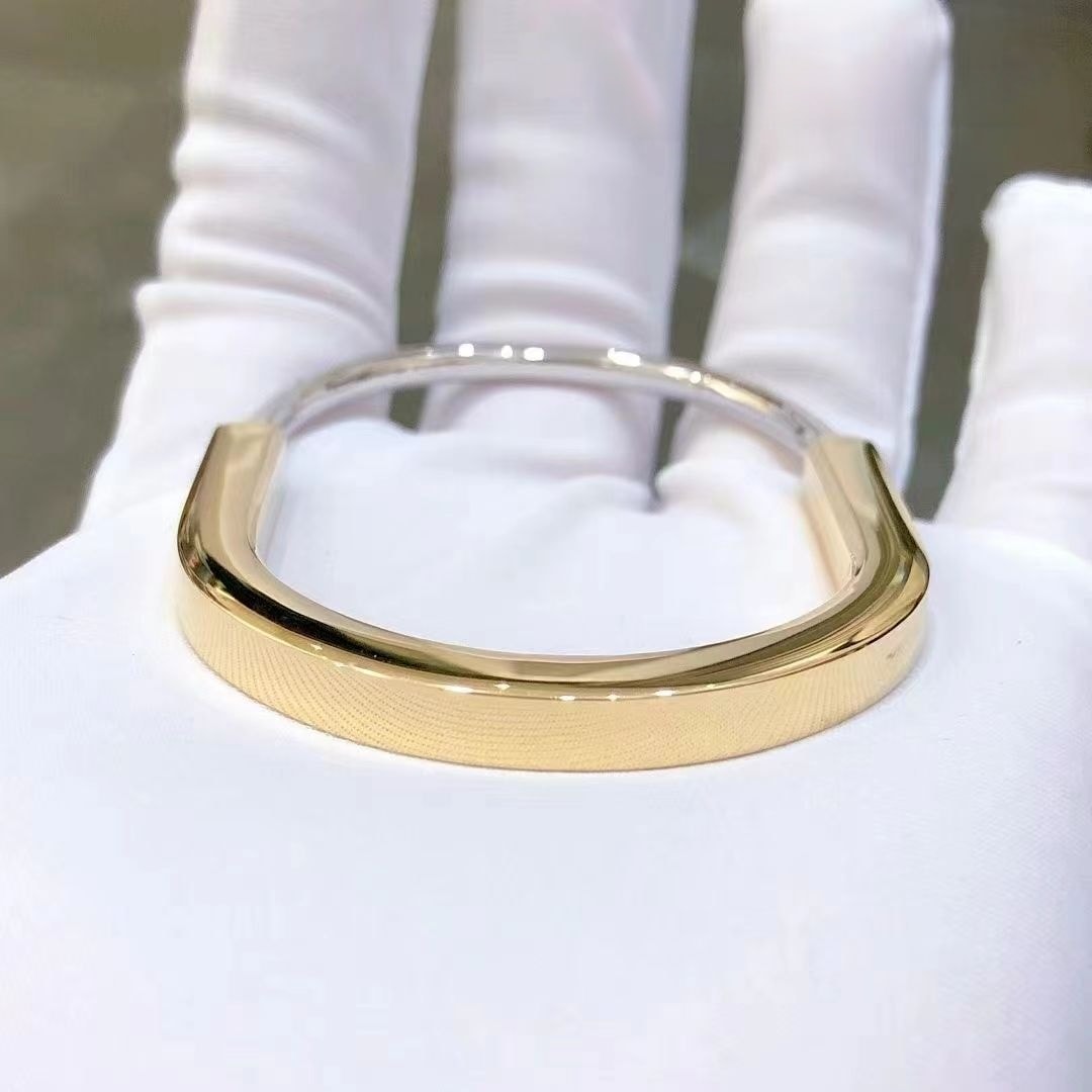 tiffany lock bangle in 18k yellow and white gold half pave diamonds bracelet